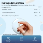 Bilden visar en magnesiumglycinat kapsel och näringsdeklarationen per portion