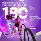 Kvinna som tränar, med en öppen burk med WeightWorlds ZMA kapslar i bakgrunden.